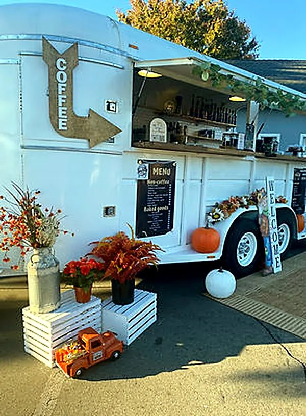 The trailer set up as a gourmet coffee bar with fall decor