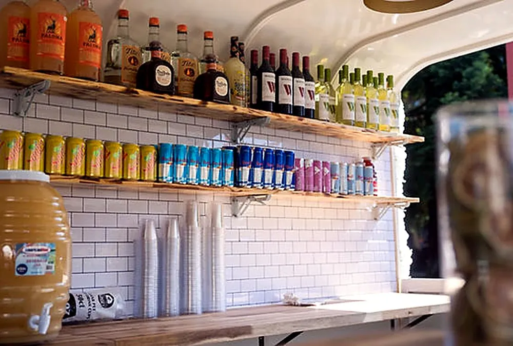 Shelves of craft beer, wine and liquor inside the trailer